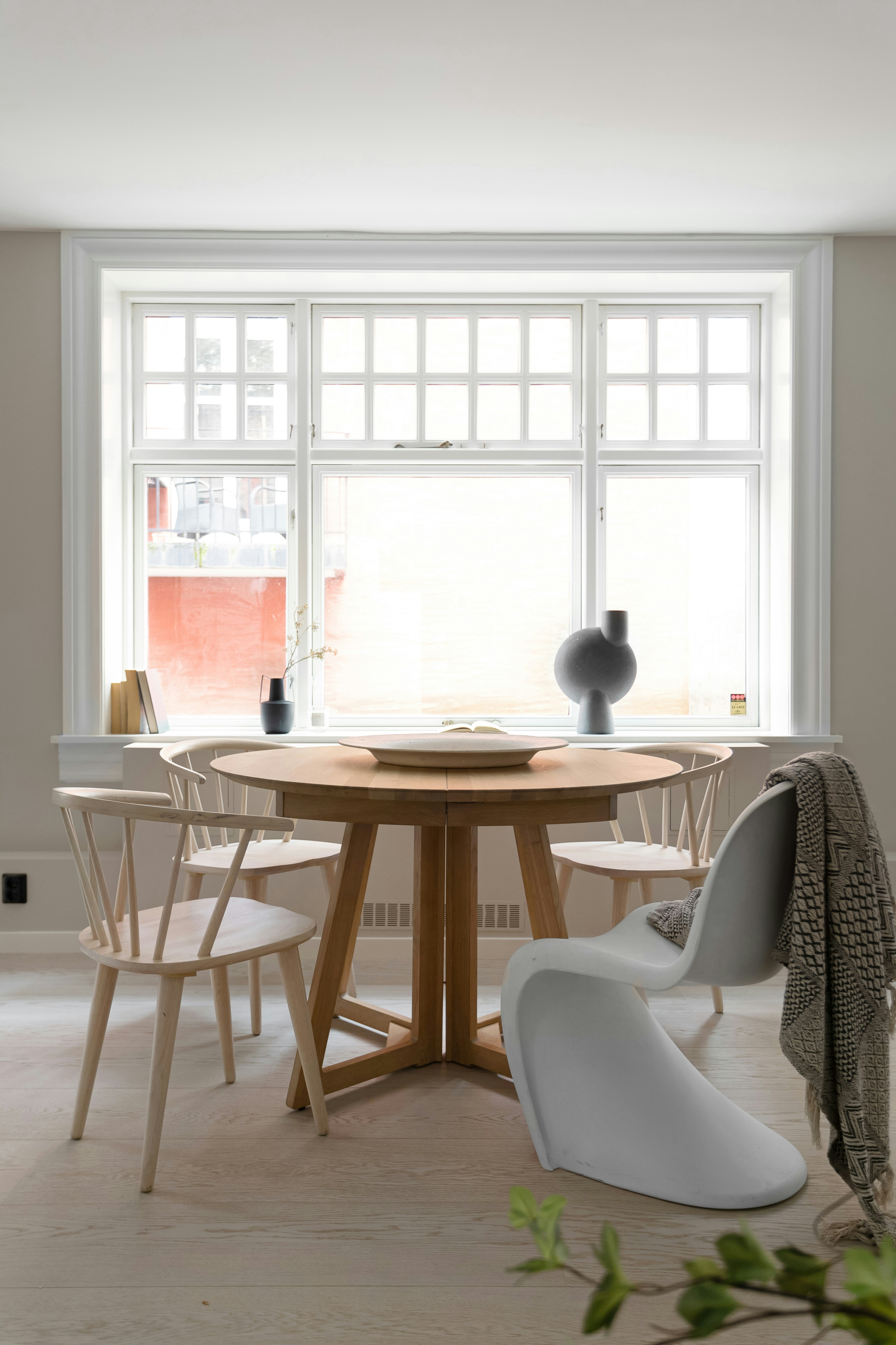 A dining room with a table and chairs